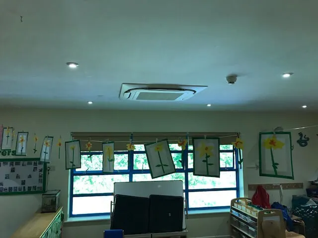 A room with a lot of clutter on the floor.