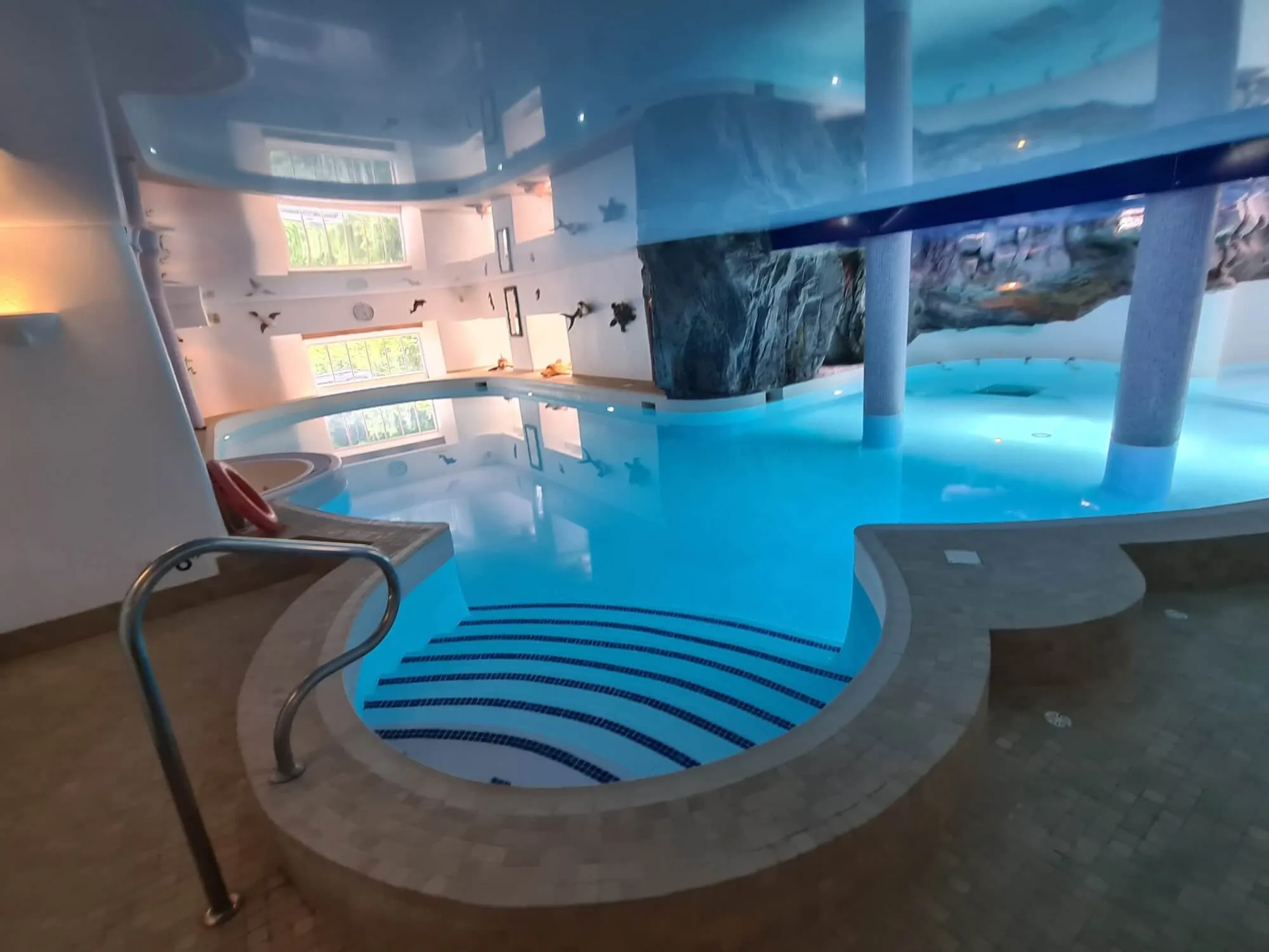 A large indoor swimming pool in a building.