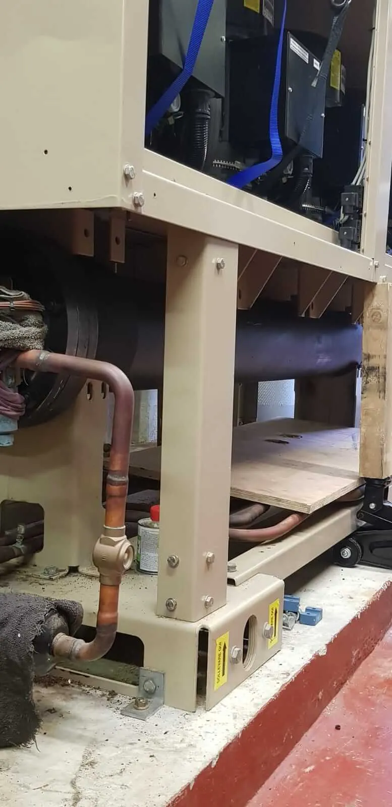 A machine that is working on a piece of wood.