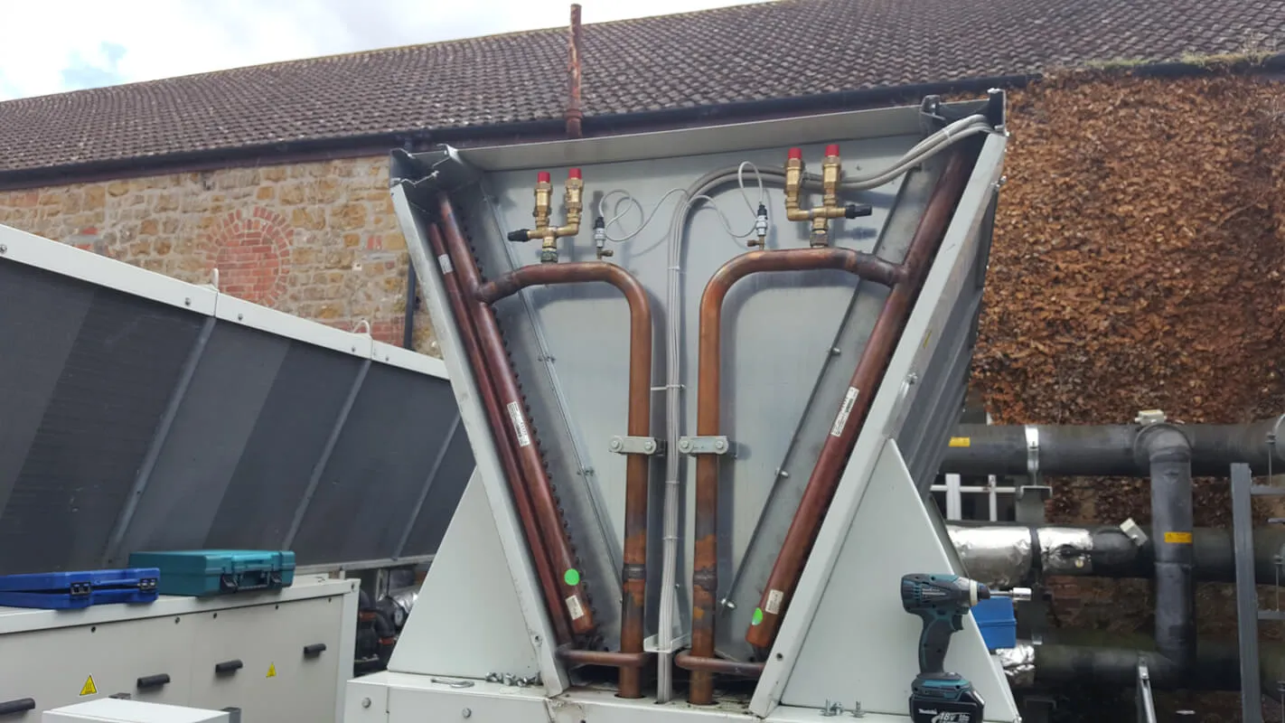 A large machine that is sitting outside of a building.